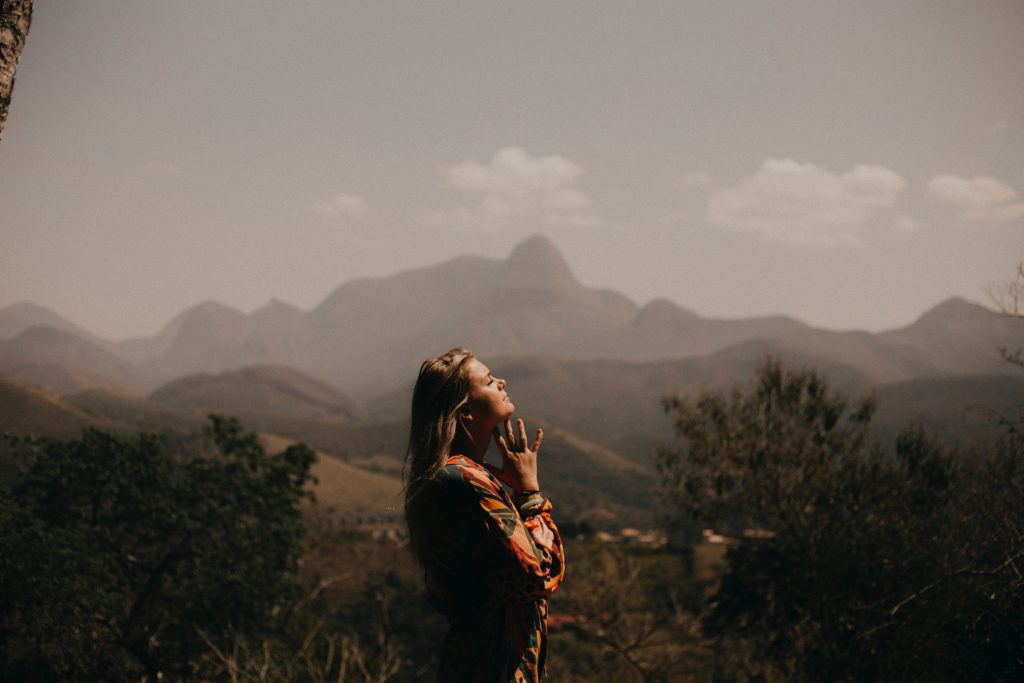 Woman praying after finding a Christian 12 step program