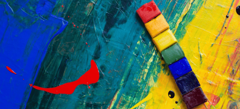 A close-up of an abstract painting in LGBTQ colors.