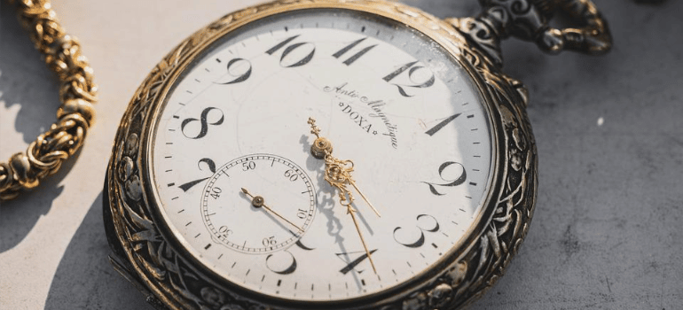 A close-up of a vintage pocket watch.