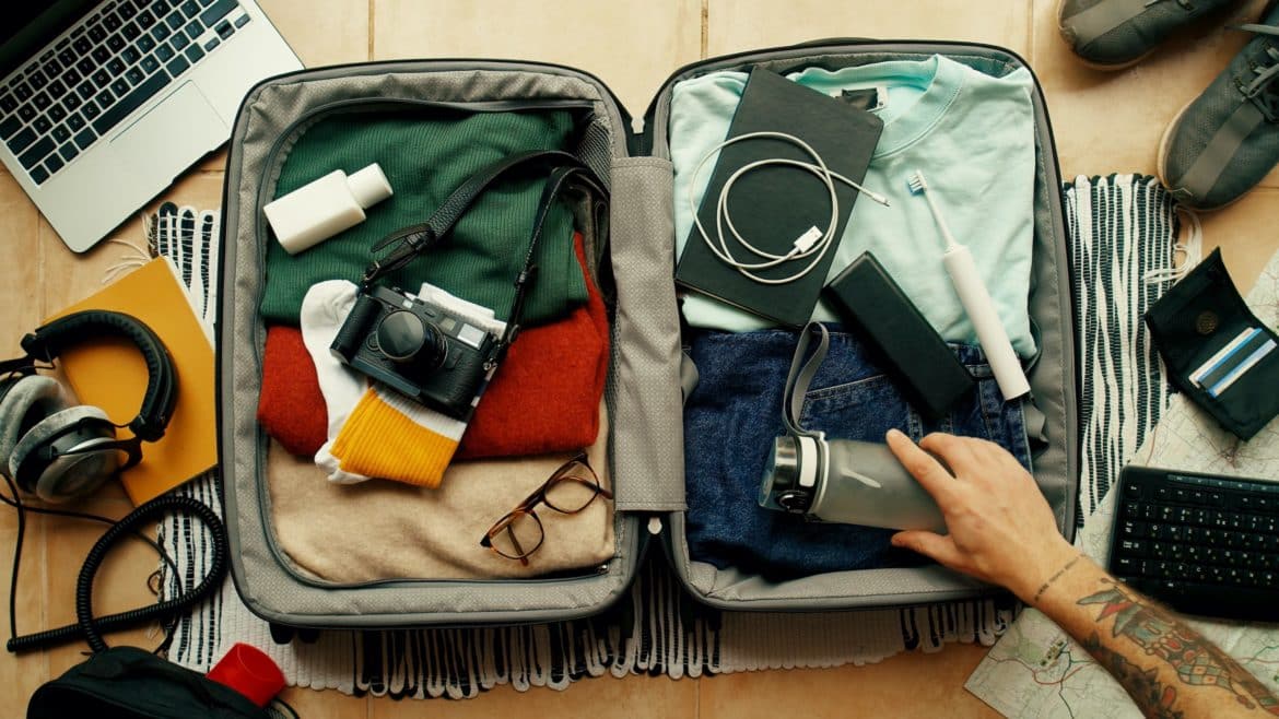 A suitcase that a person is packing for a sober living home