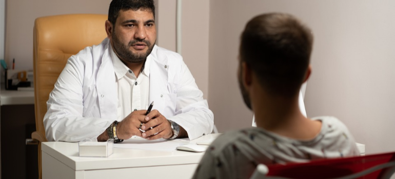 A medical professional in a consultation with a patient discussing treatment options because of benzodiazepine addiction impact on WV families and communities.