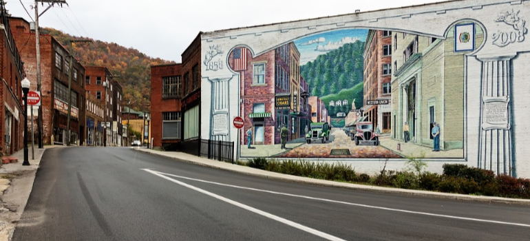 A mural on a wall by a scenic West Virginia street.