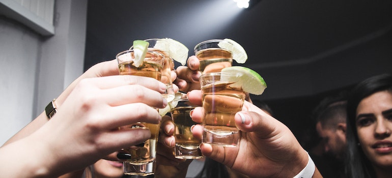 Young people drinking shots without recognizing an addiction problem