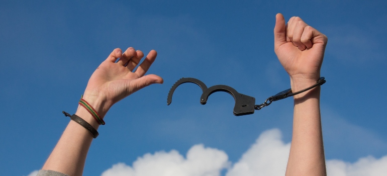 hands becoming free of handcuffs