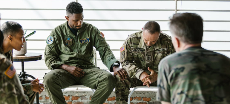 A group of men dressed in army uniforms during a group therapy session showing how to prepare for a cocaine detox program in West Virginia