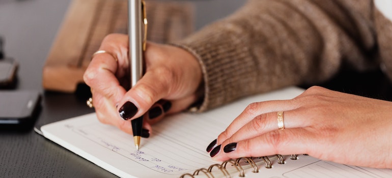 A person writing down their plans