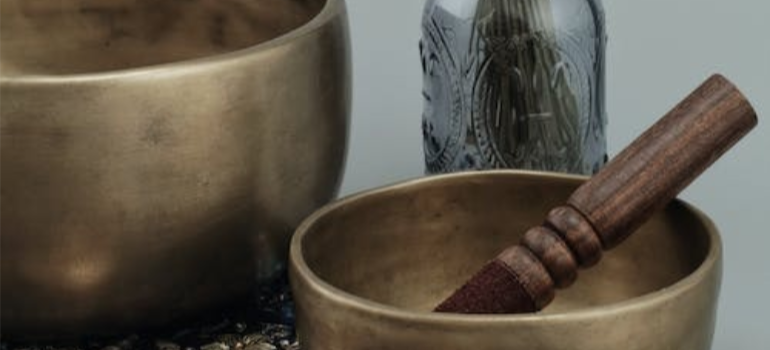 A close-up of Tibetan singing bowls used in herbal medicine.