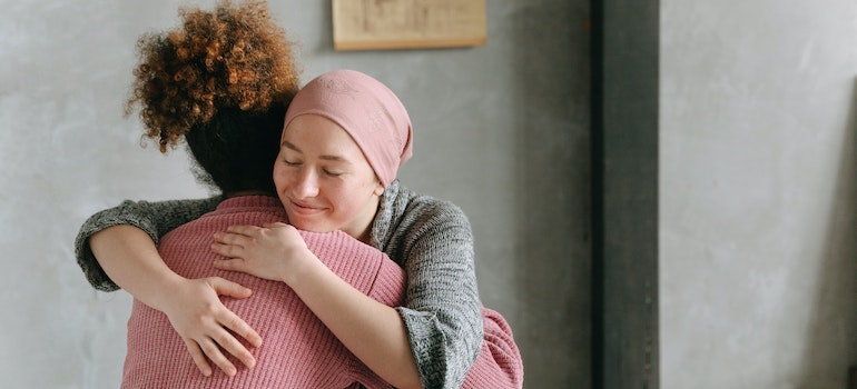 women hugging showing that gratitude can transform your mental health