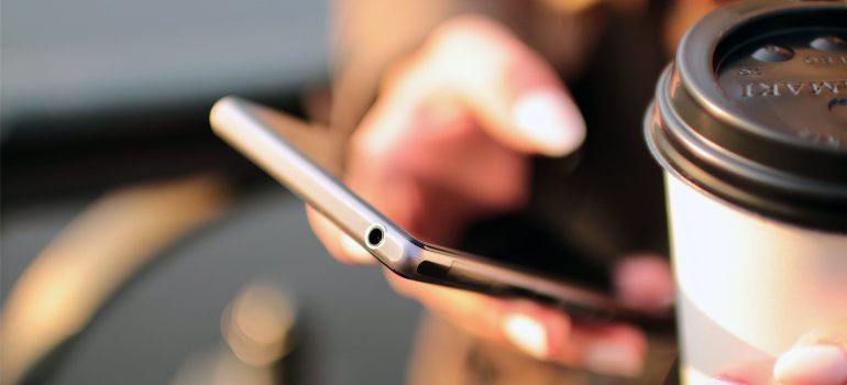 A close-up of a young person using a smartphone.