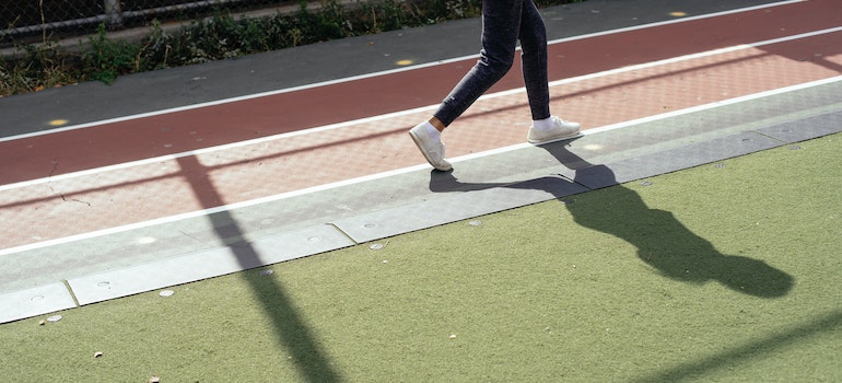 a person walking on a running track