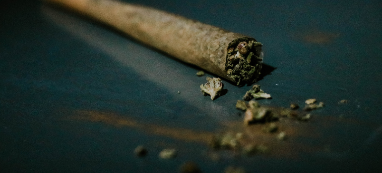 Marijuana is shown in the picture rolled up into a cigarette.