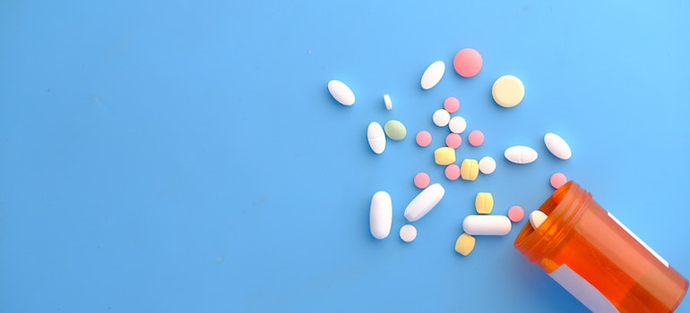 Prescription drugs on the blue surface