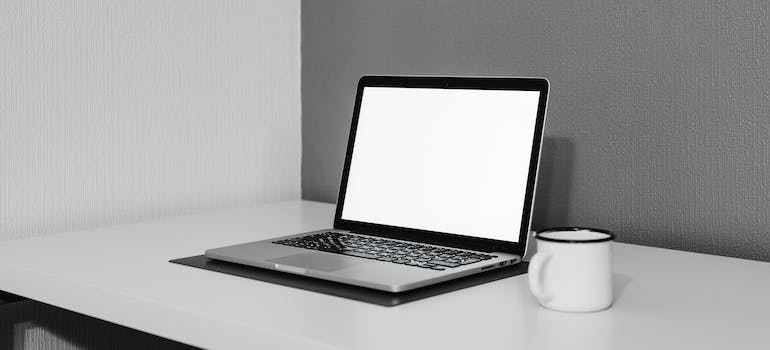 A laptop on a white table