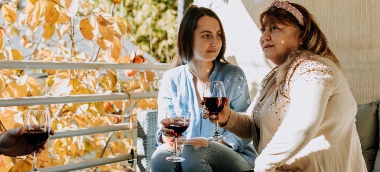 Two women drinking red wine