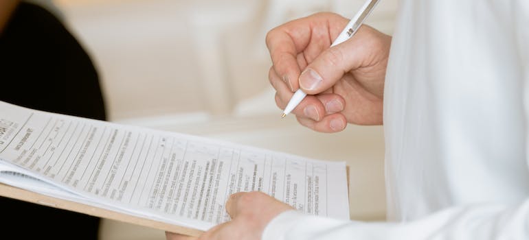 A person filling in a form for detox treatment