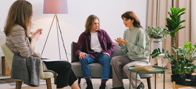 A man and a woman talking to a therapist