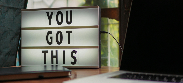 An inspiring message on a lightbox placed on a home desk, promoting positivity.