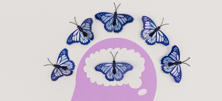 A drawing of butterflies over a human head - representation of the feeling after using TMS for addiction.