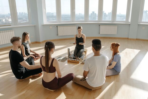 A group of people meditating in opiate rehab