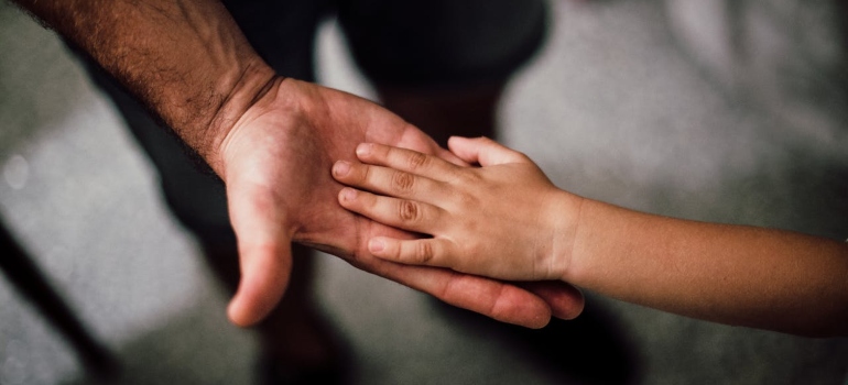 Father and child's hands together