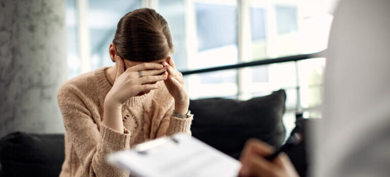 troubled woman during a psychotherapy session.