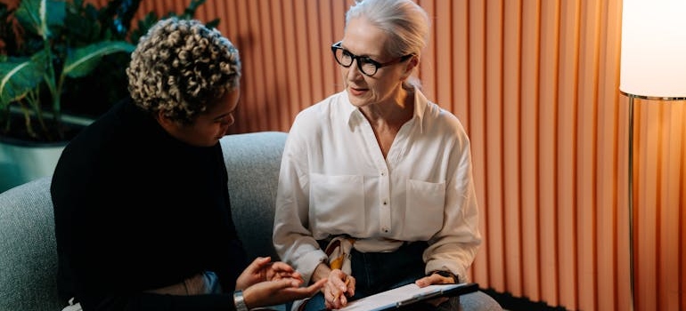 Employer talking to her employee about rehab.