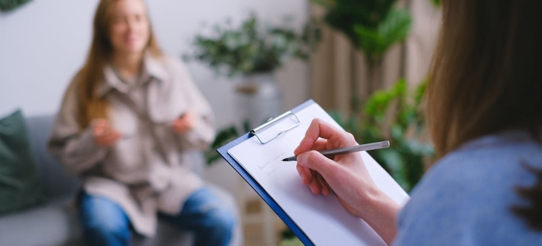 a woman taking notes