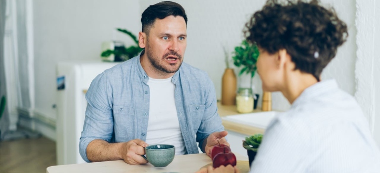 A couple fighting at the table