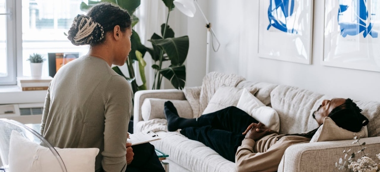 Man lying near psychologist