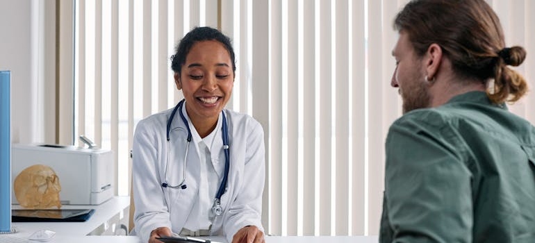 Doctor talking to her patient about the benefits of exercise in addiction recovery.