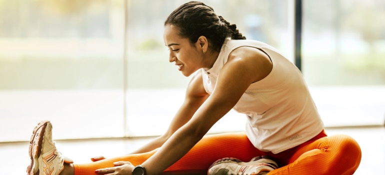 A woman exercising on the floor