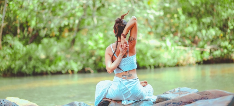 A woman sitting on stones