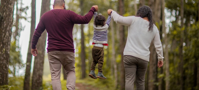 Parents holding a child and having fun is important, but it is also important that they are stable so that we can avoid the question Can a Parent Lose Custody for Drug Use in WV