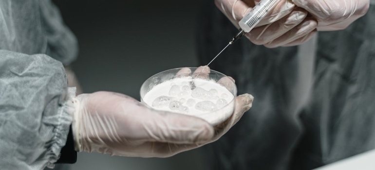 Person holding a tool with cocaine