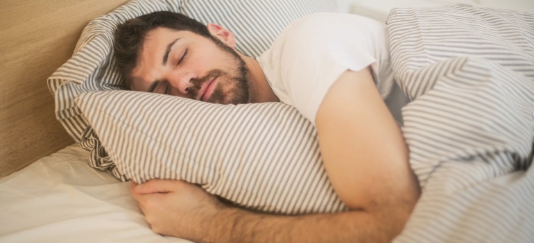 a man sleeping in a bed