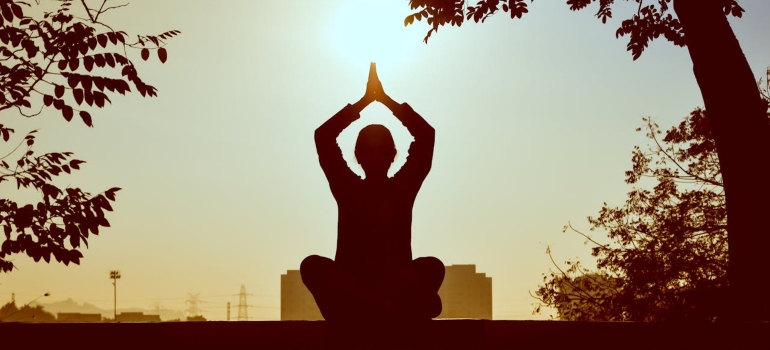 A woman meditating.