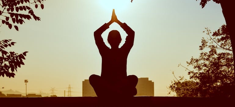 Woman doing yoga and meditating.