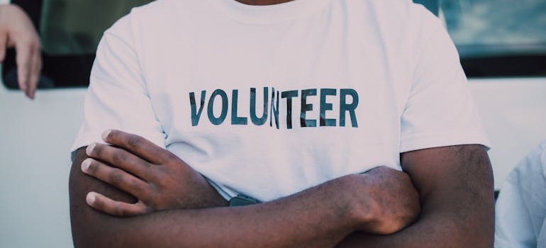 Man wearing a volunteer t-shirt.