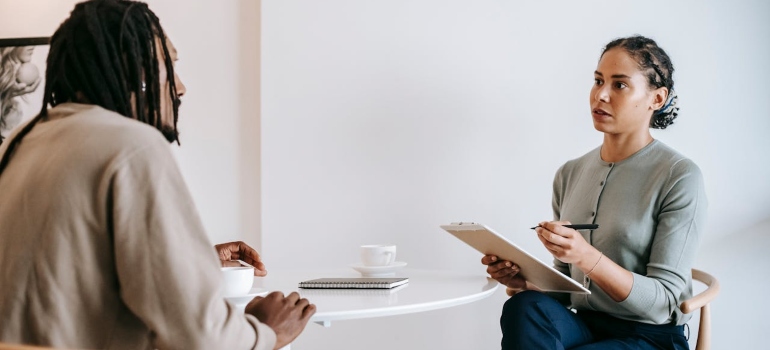 a man talking to a therapist about his opioid addiction