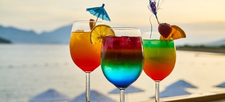 Three glasses of colorful mocktails.