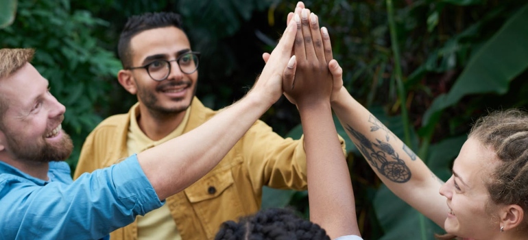 people from addiction therapy cheering to each other 