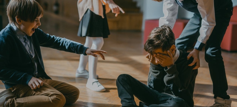 children mocking a boy