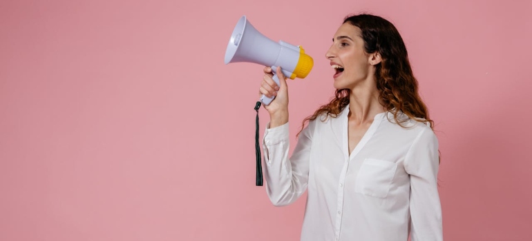 a woman speaking in the megaphone