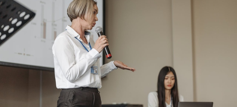 a woman speaking in the microphone