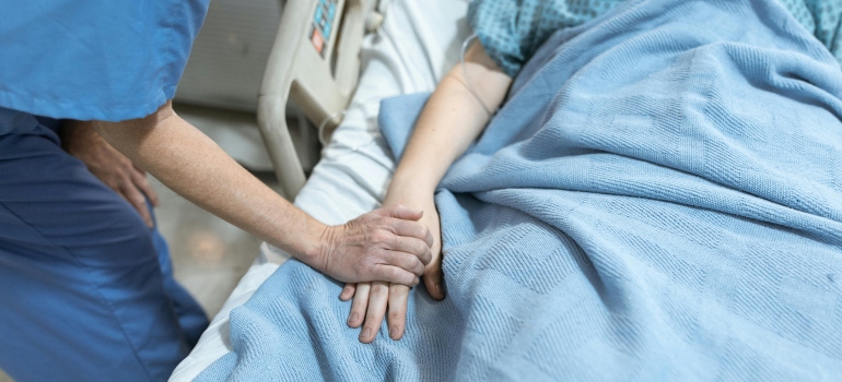 Person laying in a hospital bed