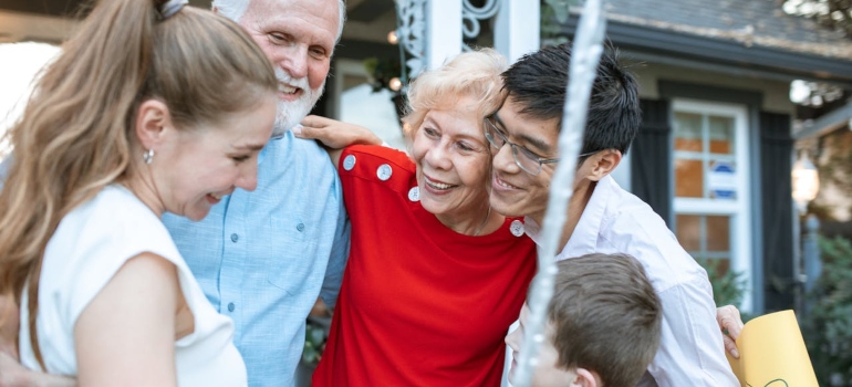 family members hugging and smiling