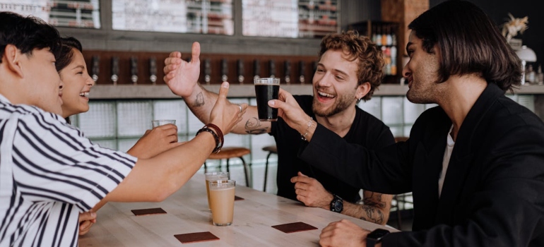 friends at a coffee shop laughing