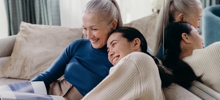 Woman laughing with her mother.