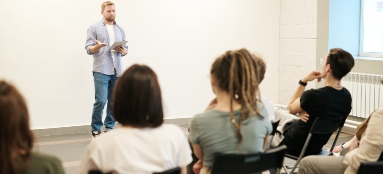 A man giving a lesson to teens on Experimenting Leading to Addiction