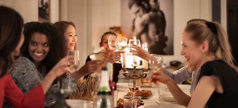 People drinking at a friend dinner.